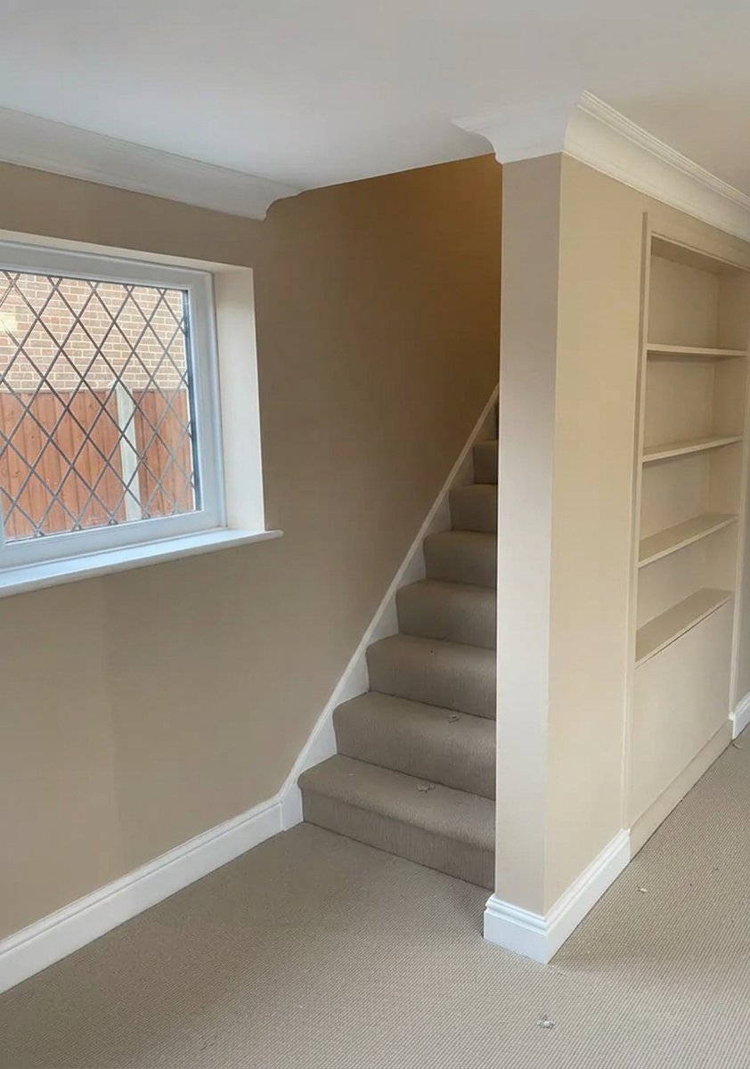Hallway and staircase walls freshly plastered to a smooth finish